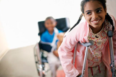 injured girl using crutches PHOTO