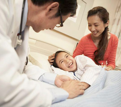 parents with recovering child in hospital PHOTO